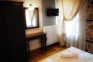 Postel nebo postele na pokoji v ubytování Chorostasi Mansion