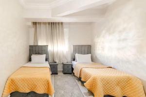 Ένα ή περισσότερα κρεβάτια σε δωμάτιο στο Modern hideaway in Casablanca