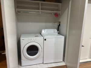 a washer and dryer in a small room at 5 mins walk to beach! Lovely, spacious bedroom near Beach, Stanley Park, Cypress Mountain, Downtown Vancouver, Grouse Mountain in West Vancouver