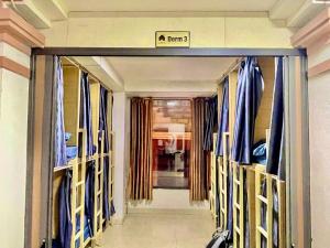 a walkway to a room with a sign that reads panic at Nhật's Sapa Central Hostel in Sapa