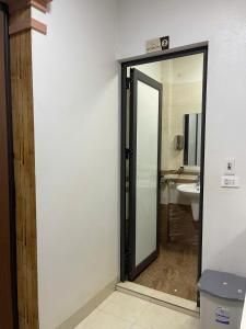 an open door to a bathroom with a sink at Nhật's Sapa Central Hostel in Sapa