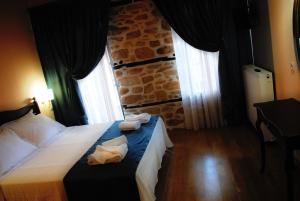 Postel nebo postele na pokoji v ubytování Chorostasi Mansion