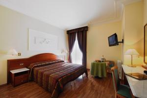 Postel nebo postele na pokoji v ubytování Hotel Benessere Villa Fiorita
