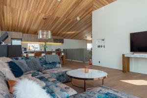 a living room with a couch and a table at Foxwood D in Niseko