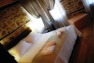 Postel nebo postele na pokoji v ubytování Chorostasi Mansion