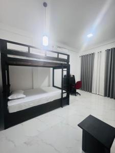 Ένα ή περισσότερα κρεβάτια σε δωμάτιο στο Janri Villa