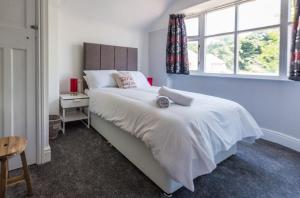 Кровать или кровати в номере Newlyn House