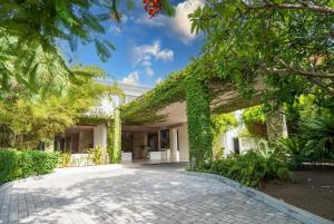 an entrance to a building covered in ivy at Hodges Bay Resort & Spa, an HQ Luxury Resort & Residences in Saint Johnʼs +166 photos