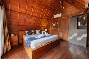 En eller flere senge i et værelse på Manyama Bungalow