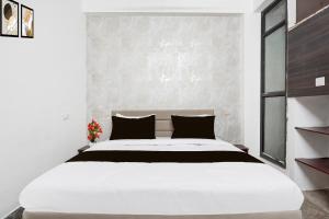Katil atau katil-katil dalam bilik di Hotel O City Park Kota Formerly Oxyluxe +21 gambar
