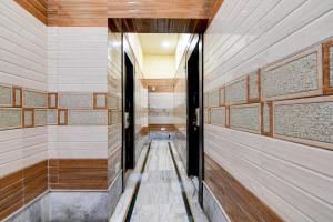 a sauna with wooden walls and a corridor at Super Hotel O NIT Durgapur Formerly Royal Inn in Durgāpur