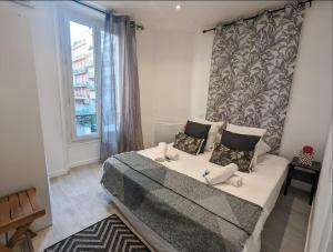 Katil atau katil-katil dalam bilik di FRGK "Le 3 Saint Paul Cannes" PARKING