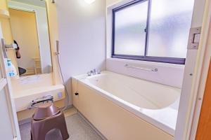 Koupelna v ubytování The Snowfront Apartment Nabe Sun -HAKUBA GORYU- + 35 fotografií