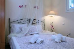 Posteľ alebo postele v izbe v ubytovaní Orizzonte Apartments Lefkada
