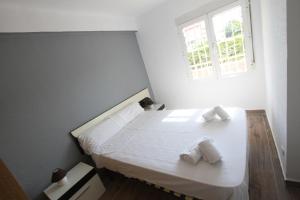 Postel nebo postele na pokoji v ubytování For a Stay Pineda Mar