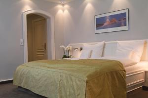 Postel nebo postele na pokoji v ubytování Hotel Rungholt
