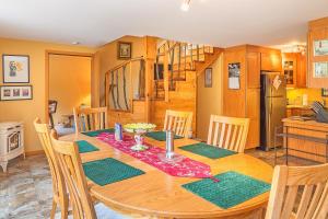 a dining room with a wooden table and chairs at The Dragonfly Cabin in Grayland