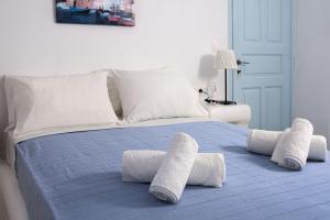 Ένα ή περισσότερα κρεβάτια σε δωμάτιο στο Glaros Hotel (By The Sea)