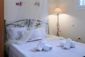 Posteľ alebo postele v izbe v ubytovaní Orizzonte Apartments Lefkada