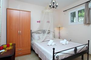 Posteľ alebo postele v izbe v ubytovaní Orizzonte Apartments Lefkada