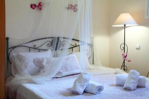 Posteľ alebo postele v izbe v ubytovaní Orizzonte Apartments Lefkada