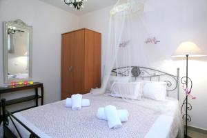 Posteľ alebo postele v izbe v ubytovaní Orizzonte Apartments Lefkada