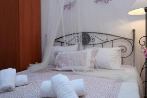 Posteľ alebo postele v izbe v ubytovaní Orizzonte Apartments Lefkada