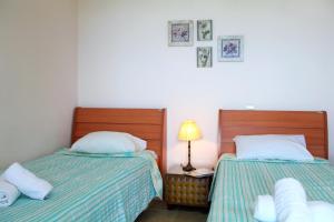 Posteľ alebo postele v izbe v ubytovaní Orizzonte Apartments Lefkada