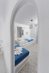 Ένα ή περισσότερα κρεβάτια σε δωμάτιο στο Glaros Hotel (By The Sea)
