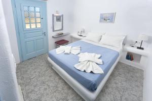 Ένα ή περισσότερα κρεβάτια σε δωμάτιο στο Glaros Hotel (By The Sea)