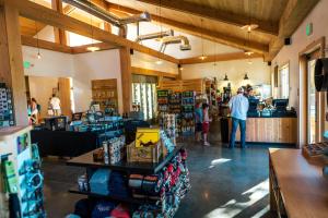 a store with people standing in a store at Rush Creek Lodge at Yosemite in Groveland