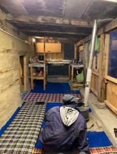 a room with a room with a stove in it at Mirvana home stay in Kalgha