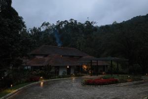 a house with a fire on top of it at Aelam Acres in Chillithodu +17 photos
