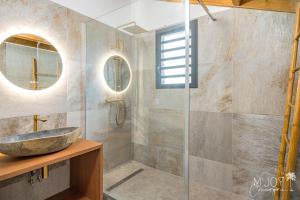 a bathroom with a sink and a glass shower at KAZ BALEN***** Villa 10 pers à St-Leu in Le Portail +31 photos