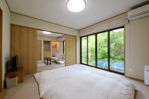 Postel nebo postele na pokoji v ubytování 小涌谷 樂 - kowakudani Raku