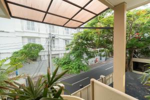 a balcony with a view of a street at Mirah Villas in Denpasar