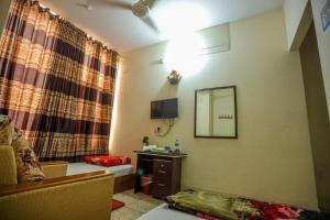 Μια τηλεόραση ή/και κέντρο ψυχαγωγίας στο Hotel White House International +27 φωτογραφίες