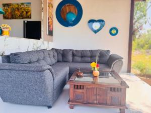 a living room with a couch and a coffee table at Bale Penida Villa in Nusa Penida