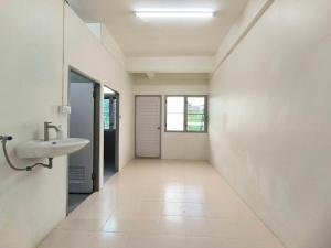 a white hallway with a sink and a mirror at Townhouse, 500m the Pink Line MRT, Near Airport  +29 photos