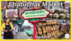 a woman in a store with a sign in a market at Townhouse, 500m the Pink Line MRT, Near Airport 