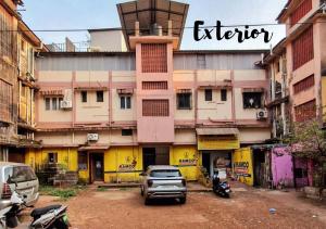 a truck parked in front of a building at Newly Renovated 2BHK in Margao in Madgaon