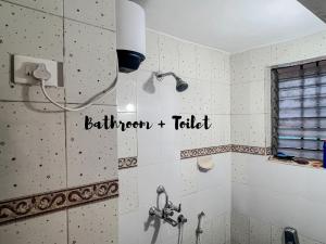 a bathroom with a shower and a sink at Newly Renovated 2BHK in Margao in Madgaon +8 photos