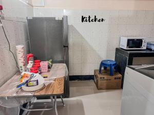 a kitchen with a table with food on it at Newly Renovated 2BHK in Margao in Madgaon