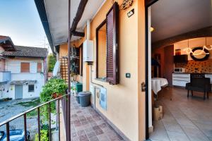 a balcony of a house with a view of the street at InCorteDaFabio Design flat with Bikes in Caronno Pertusella