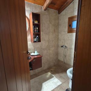 a bathroom with a toilet and a sink at Eden Stay in Edessa +101 photos