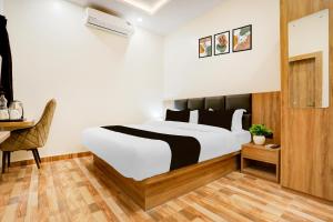 Ένα ή περισσότερα κρεβάτια σε δωμάτιο στο Super Townhouse Oak AIIMS Walmi Govindpur +23 φωτογραφίες