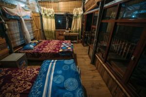 a room with two beds and a balcony in an rv at Chez Beo Homestay in Ninh Binh +62 photos