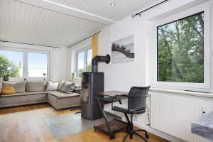 a kitchen with a desk and a chair in a room at Im Alpennest die Ruhe genießen in Kressen