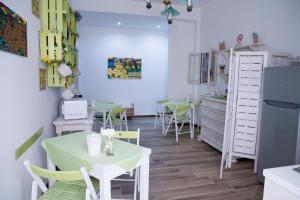 a kitchen and dining room with a table and chairs at B&B Castello in Crotone