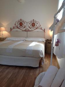 A bed or beds in a room at Il Gelsomino